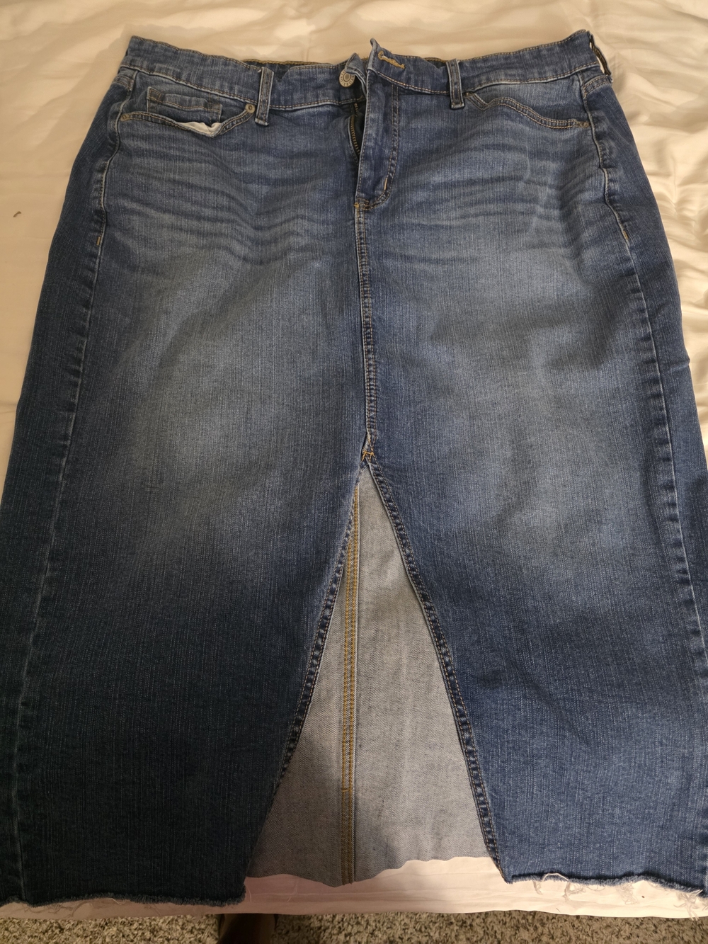 Torrid Women's Mid Wash Denim Skirt with Front Slit at the knee.